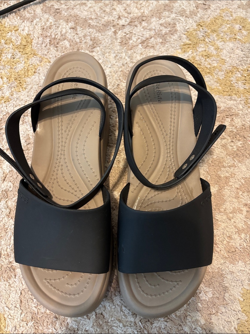 CROCS Women’s Black Strap Sandals with Tan Footbed. Few scrape marks.